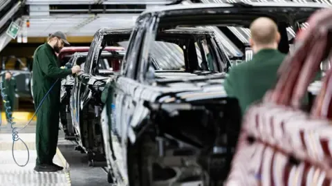 Jaguar Land Rover Vendor Network Workers Allegedly Instructed to Apply for Government Benefits, Labor Group States
